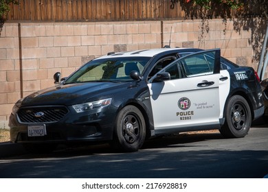 Northridge, California, United States -  June 29, 2022: A LAPD Ford Taurus Police Car At The Scene Of A Multi-agency Task Force Including LAPD Narcotics Detectives Staging For A Raid On A Location.