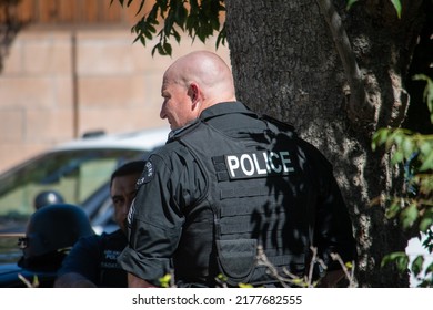 Northridge, California, United States -  June 29, 2022: A LAPD Sergeant Stages On A Community Street Prior To A Drug Policy Enforcement Raid With A Multi-agency Task Force, With A Vest Saying 