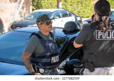 Northridge, California, United States -  June 29, 2022: A Multi-agency Task Force Including LAPD Narcotics Detectives Stages On A Community Street Prior To A Drug  Enforcement Raid Wearing Vests.