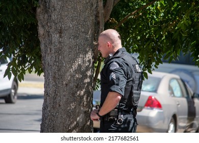 Northridge, California, United States -  June 29, 2022: A LAPD Sergeant Stages On A Community Street Prior To A Drug Policy Enforcement Raid With A Multi-agency Task Force, With A Vest Saying 