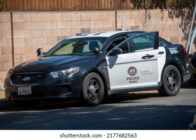 Northridge, California, United States -  June 29, 2022: A LAPD Ford Taurus Police Car At The Scene Of A Multi-agency Task Force Including LAPD Narcotics Detectives Staging For A Raid On A Location.