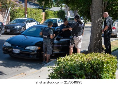 Northridge, California, United States -  June 29, 2022: A Multi-agency Task Force Including LAPD Narcotics Detectives Stages On A Community Street Prior To A Drug  Enforcement Raid Wearing Vests.