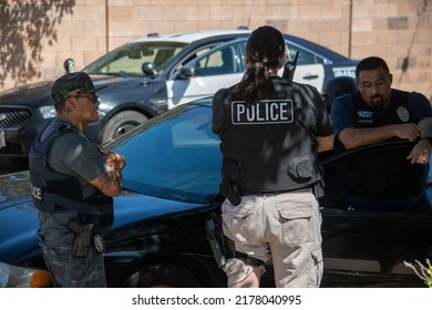 Northridge, California, United States -  June 29, 2022: A Multi-agency Task Force Including LAPD Narcotics Detectives Stages On A Community Street Prior To A Drug  Enforcement Raid Wearing Vests.