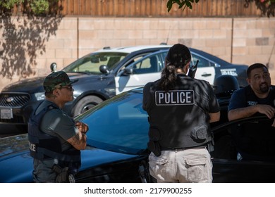 Northridge, California, United States -  June 29, 2022: A Multi-agency Task Force Including LAPD Narcotics Detectives Stages On A Community Street Prior To A Drug  Enforcement Raid Wearing Vests.