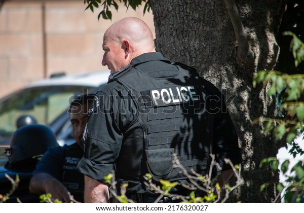 Northridge, California, United States -  June 29,\
2022: A multi-agency task force including LAPD Narcotics detectives\
stages on a community street prior to a drug policy enforcement\
raid.