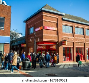 Northwich, Cheshire/Uk March 20th 2020: Shoppers Queuing Outside Iceland Supermarket During The Corona Virus Crisis, Northwich, Cheshire Uk.  