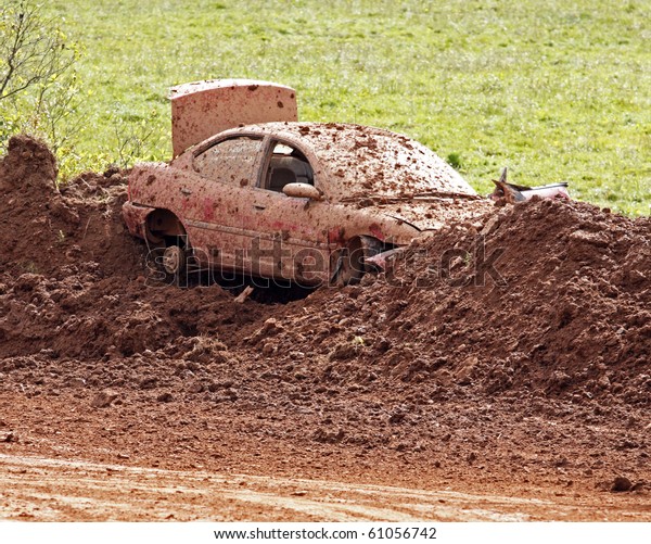 NORTON, CANADA - SEPTEMBER 11: A junked car forms\
part of the bank at a demolition derby on September 11, 2010 in\
Norton, Canada.