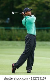 NORTON, MA-SEP 1: Tiger Woods hits a fairway shot during the third round at the Deutsche Bank Championship at TPC Boston on September 1, 2013 in Norton, Massachusetts. 