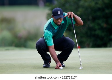 NORTON, MA-SEP 1: Tiger Woods lines up a putt on the green during the third round at the Deutsche Bank Championship at TPC Boston on September 1, 2013 in Norton, Massachusetts. 