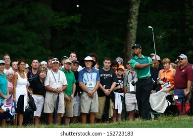 NORTON, MA-SEP 1: Tiger Woods Hits Out Of The Rough During The Third Round At The Deutsche Bank Championship At TPC Boston On September 1, 2013 In Norton, Massachusetts. 