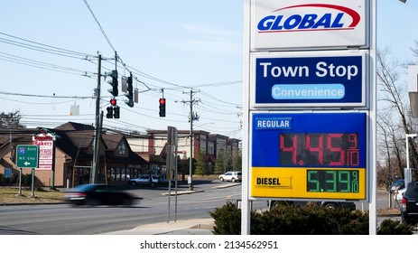 NORWALK, CT, USA - MARCH 11, 2022: Global gas station price sign near Post road and I -95 view in  nice sunny day with blue sky