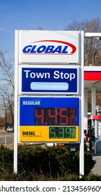 NORWALK, CT, USA - MARCH 11, 2022: Global gas station price sign near Post road and I -95 view in  nice sunny day with blue sky