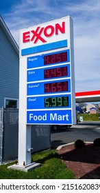 NORWALK, CT, USA - MAY 1, 2022:  Exxon gass station price sign  near Post road with blue sky