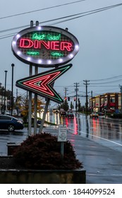 NORWALK, CT, USA-OCTOBER 30, 2020: Postal Road Diner in rainy October morning with street traffic lights on Connecticut Avenue