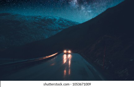 Norway Adventures, Night Road Trip Under The Stars, Traveling In The Car At Nighttime, Driving Along Hight Snowy Mountains, Freedom Concept
