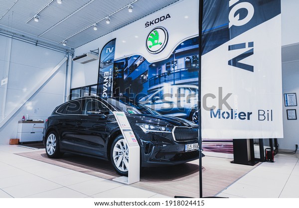 Tønsberg,
Norway - February 11, 2021: black Skoda enyaq IV is a suv electric
car. New car in car dealership show
room.