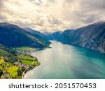 Norway - High Dynamic Range landscape view from above of Norwegian Fjords in the route from Bergen to Tyssedal. Drone shot, HDR, cloudy sky, morning light. Beautiful panorama.