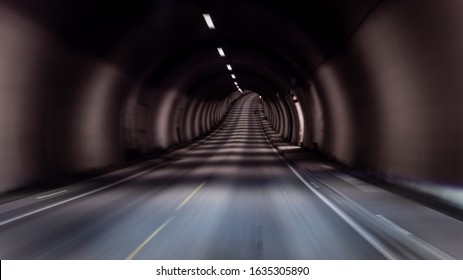 Norway  inside to the subsea two  lane road tunnel that lies the depth 88 meters below the Bussesundet strait  The 2890  m long tunnel connects the island Vardo to the main land  Motion blur 