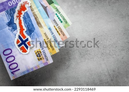 Norway money and national emblem, Gray background, copy space, flat lay, Financial background
