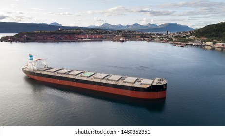 NORWAY, NARVIK - APRIL 15, 2019: Aerial Shot Of A Iron Ore Cargo Ship In Narvik Bay, Narvik, Norway