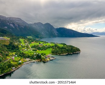 Norway - Nature around the road from Bergen to Tyssedal. Landscape of the Norwegian fjords. Drone shot, HDR, cloudy sky, morning light. Beautiful green panorama.