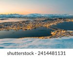 Norway- Troms og Finnmark- Tromso- long exposure of illuminated city seen from Fjellheisen at sunset