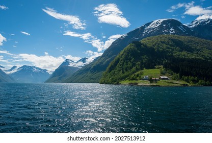 Norwegian Fjord With Blue Skies And Houses On Grass Copy Space Negative Space No People