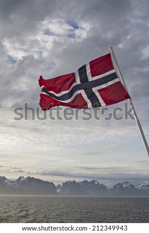 Norwegian flag and view to the Lofoten islands