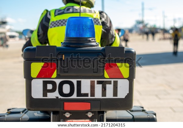 Norwegian police. Reflective politi sign on\
the motorcycle.