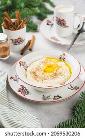 Norwegian Traditional Rice Porridge With Butter And Cinnamon. Milk In The Cup With Santa. Christmas Mood