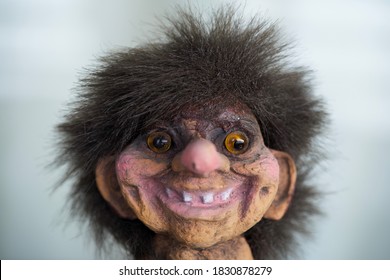 Norwegian troll toy on white background