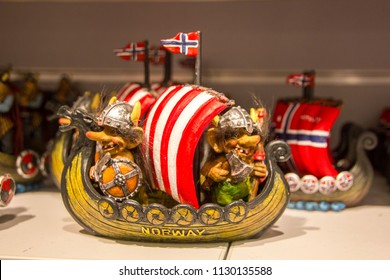 Norwegian trolls on a viking ship, tourist souvenir from Norway with the Norwegian flag