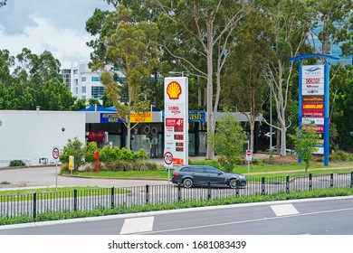 NORWEST, NSW / AUSTRALIA - MARCH 9, 2020: Holden Commodore Exiting Shell Petrol Station, Car Wash In Background                                                              