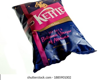 Norwich, Norfolk, UK – December 24 2020. An Illustrative Editorial Photo Of A Close Up Of A Packet Of Kettle Chips Sea Salt And Balsamic Vinegar Flavoured Crisps On A Plain White Background