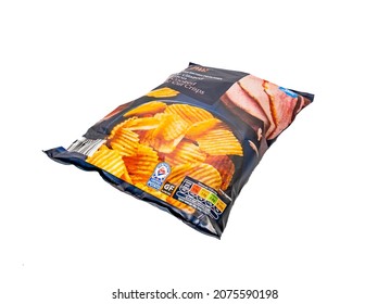 Norwich, Norfolk, UK – November 2014. A Packet Of Luxury Glazed Gammon Ham Flavoured Crisps Cut Out Isolated On A Plain White Background