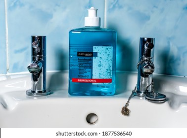 Norwich, Norfolk, UK – November 28 2020. An illustrative editorial photo of a bottle of Chefs Larder professional antibacterial handwash on a white sink