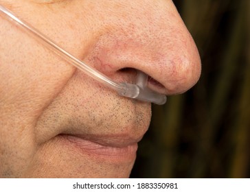 Nose And Lips Of Old Man With Nasal Cannula For Deliver Supplemental Oxygen And Respiratory Help