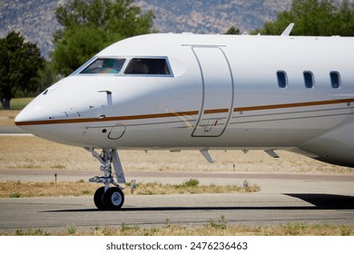 Nose of a Private Jet on the runway - Powered by Shutterstock