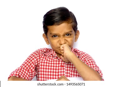 Nose Scrunching Expression Of A Little Indian Boy 