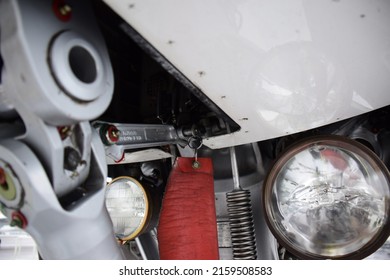 Nose Wheel Landing Gear Of A Commercial Passenger Aircraft With A Remove Before Flight Flag And The Taxi Lights