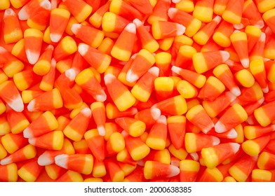 Nostalgic American Tradition, Iconic Trick Or Treat Sweets And Halloween Backgrounds Concept With Full Frame Of Many Candy Corn Pieces With Copy Space