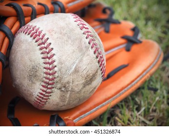 Nostalgic Baseball In Glove On A Baseball Field, Selective Focus And Close Up Image 