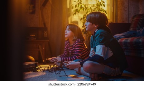 Nostalgic Childhood Concept: Young Brother And Sister Playing Old-School Arcade Video Game On A Retro TV Set In A Living Room With Period-Correct Interior. Friends Spend The Day At Home Playing Games.