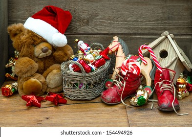 nostalgic christmas decoration with antique toys over wooden background. retro style picture