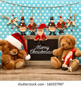 nostalgic home christmas decoration with antique toys. vintage arrangement  and blackboard with sample text Merry Christmas - Powered by Shutterstock