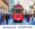 Nostalgic retro red tram on famous Istiklal street. Istiklal Street is a popular tourist destination in Istanbul.