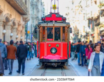 Nostalgic retro red tram on famous Istiklal street. Istiklal Street is a popular tourist destination in Istanbul.