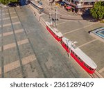 Nostalgic retro tram at central Muratpasa district. Old tram is a popular tourist attraction in Antalya. Drone view