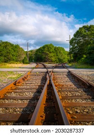 Nostalgic Travel Landscape And Dramatic Cloudscape With Curved Railroads In The Forest On Cape Cod