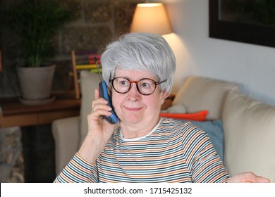 Nosy Senior Woman Using Landline Phone